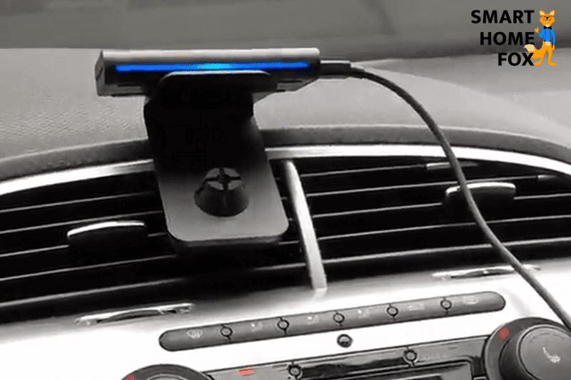 Amazon Alexa Echo for the car is attached to the dashboard.